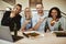 Laughing diverse office coworkers having pizza and beer after wo