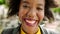 Laughing edgy woman with an afro sightseeing in a city. Closeup portrait, headshot, face of fun, happy tourist standing