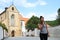 Laughing girl in front of Monastery Temple of the Assumption of the Virgin Mary