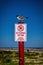 Laughing Gull Perched on No Parking Sign Post