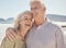 Laughing, happy and senior couple at the beach with love, freedom and care on vacation. Funny man and woman on