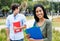 Laughing indian female student with caucasian male student