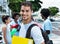 Laughing latin male student with group of friends