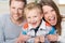 Laughing little boy with his young parents