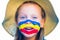 Laughing little girl in straw hat with painted face having fun