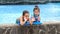 Laughing Little Girls Enjoying Swimming Pool