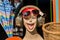 Laughing mannequin with retro headphones and sun glasses