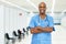 Laughing mature adult african american male nurse at vaccination station for vacinating patients