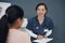 Laughing is a natural cure. a young female doctor writing down a patients information in an office.