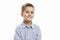 Laughing school-age boy with changing front teeth in a blue shirt. Isolated over white background