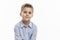 Laughing school boy in a blue shirt. Isolated over white background