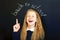 laughing school child near school blackboard