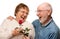 Laughing Senior Husband Giving Red Rose to Wife