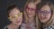 Laughing teenage girls wearing colorful eyeglasses