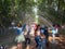 Laughing tourists in fountain-cracker Water Road