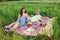 Laughing vivacious couple on a summer picnic