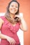 Laughter woman in red polka dress