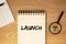 Launch word on planner on wooden office desk