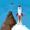 Launching rocket mountain with flag success start up business