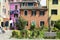 Laundries drying in the middle of the courtyard between traditional colorful houses in Burano