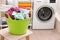 Laundry basket with dirty clothes on stool in bathroom