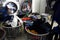 Laundry baskets filled with dirty clothes are lined up inside a laundromat