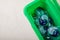 Laundry capsules on a white marble background