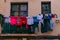 Laundry clothes drying outside a window in a Spanish city
