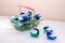 Laundry detergent pods for washing machine in a mini shopping basket