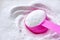 Laundry detergent powder and pink plastic scoop