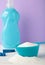 Laundry detergents with washing powder on purple background. Vertical photo