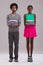 Laundry reflecting lifestyl. Studio shot of a young man and woman each holding a neatly folded pile of clothes.