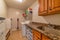 Laundry room of home with sink washing machine dryer cabinets and storage bins