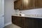 Laundry room interior features blue and grey walls