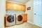 Laundry room with modern appliances