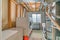 Laundry room with two washing machines and wooden ceiling