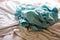 Laundry, Used turquoise crumpled bed sheet on white bed, Selective focus, Bedroom cleaning concept