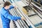 Laundry worker in the process of working on automatic machine for carpet washing