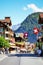 Lauterbrunnen, Switzerland - July 16, 2019: Main street in picturesque Alpine village Lauterbrunnen photographed in summer season