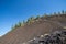 Lava Butte, a cinder cone in Newberry Crater National Monument on a sunny day