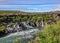 Lava falls Hraunfossar run as tiny waterfalls and rapids into the Hvita River, Borgarfjordur, West Iceland, Europe