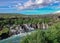 Lava falls Hraunfossar run as tiny waterfalls and rapids into the Hvita River, Borgarfjordur, West Iceland, Europe