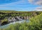 Lava falls Hraunfossar run as tiny waterfalls and rapids into the Hvita River, Borgarfjordur, West Iceland, Europe