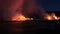 Lava running in the ocean from volcanic lava eruption on Big Island Hawaii. Seen from lava boat tour. Lava from Kilauea