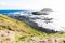 Lava stone coastline and Round island at the Nobbies at Phillip Island, Victoria, Australia