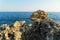 Lava stone in front of blue Mediterranean sea on the shoreline of Alanya city. Antalya, Turkey.