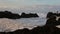 Lava stones on the beach of Piscinas Naturais Biscoitos. Atlantic Ocean. Terceira Azores, Portugal.