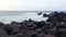 Lava stones on the beach of Piscinas Naturais Biscoitos. Atlantic Ocean. Terceira Azores, Portugal.