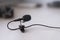 The lavalier microphone lies on a table