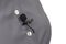 The a lavalier microphone is secured with a clip on a gray women`s shirt close-up. Audio recording of the sound of the voice on a